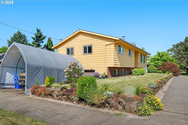 3511 NE Holman St, Portland, OR 97211 - view of property exterior with a yard and a chimney