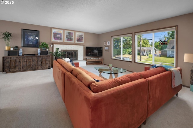 3511 NE Holman St, Portland, OR 97211 - living room featuring light colored carpet and a fireplace