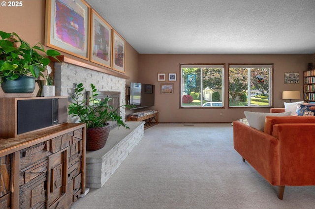 3511 NE Holman St, Portland, OR 97211 - living room featuring light colored carpet, a fireplace, and a textured ceiling