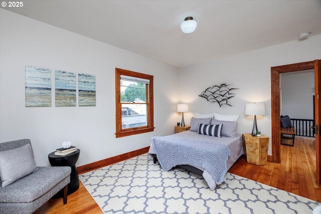 714 SE 35th Ave, Portland, OR 97214 - bedroom featuring wood finished floors and baseboards