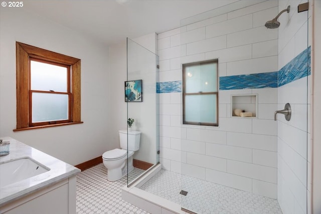 714 SE 35th Ave, Portland, OR 97214 - bathroom with toilet, tiled shower, vanity, and baseboards