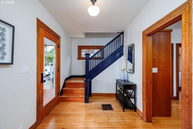 714 SE 35th Ave, Portland, OR 97214 - entryway with light wood-style floors, stairway, and baseboards