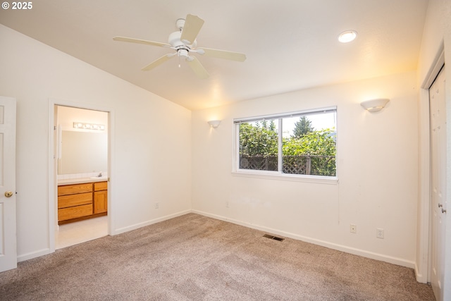 576 S 35th St, Springfield, OR 97478 - unfurnished bedroom with light colored carpet, vaulted ceiling, ensuite bath, and a closet
