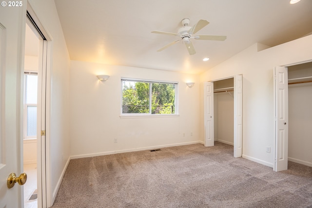 576 S 35th St, Springfield, OR 97478 - unfurnished bedroom with two closets, carpet flooring, lofted ceiling, recessed lighting, and ceiling fan