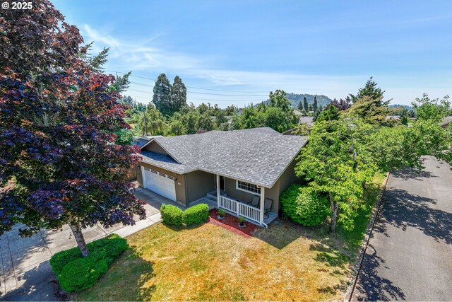 576 S 35th St, Springfield, OR 97478 - single story home with covered porch, a shingled roof, a garage, a front lawn, and driveway