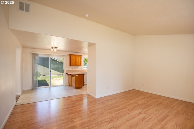 576 S 35th St, Springfield, OR 97478 - unfurnished living room featuring light wood-type flooring and baseboards