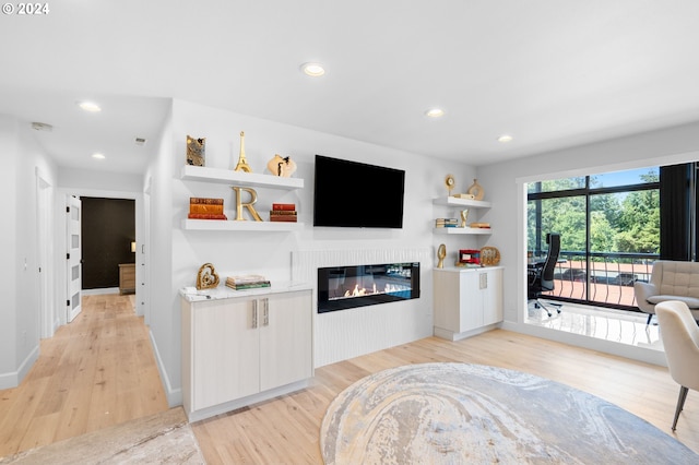 living room with light hardwood / wood-style flooring