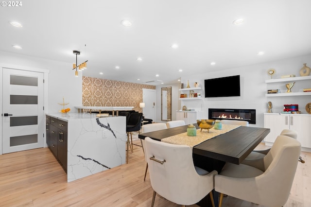 dining area with light hardwood / wood-style floors