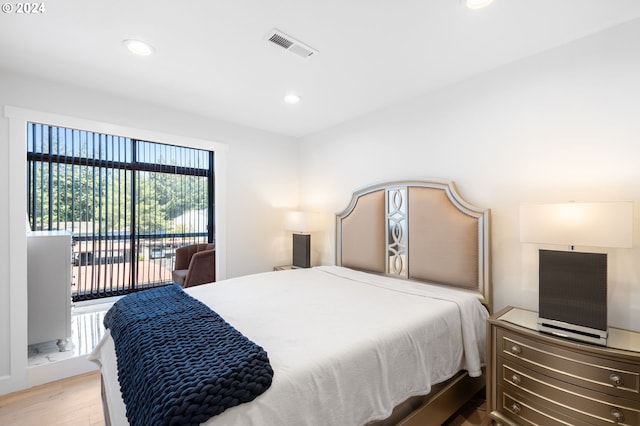 bedroom with light hardwood / wood-style flooring