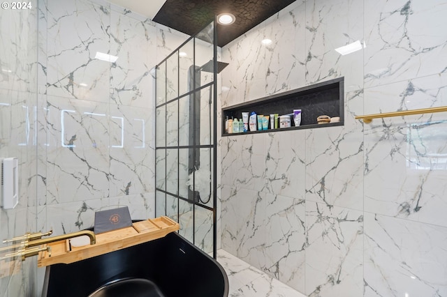 bathroom with a tile shower