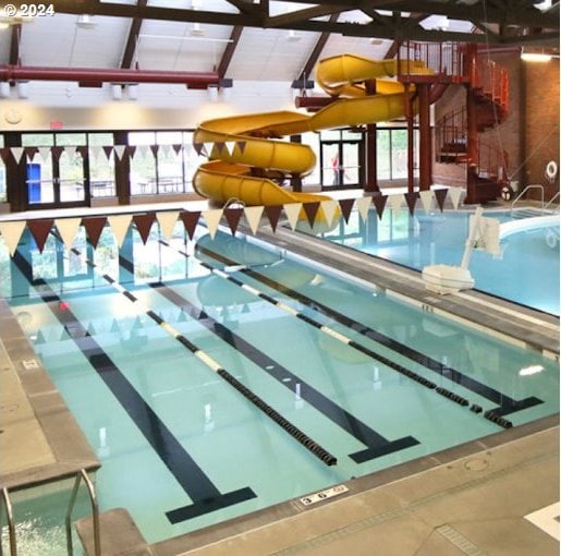 view of pool with a water slide