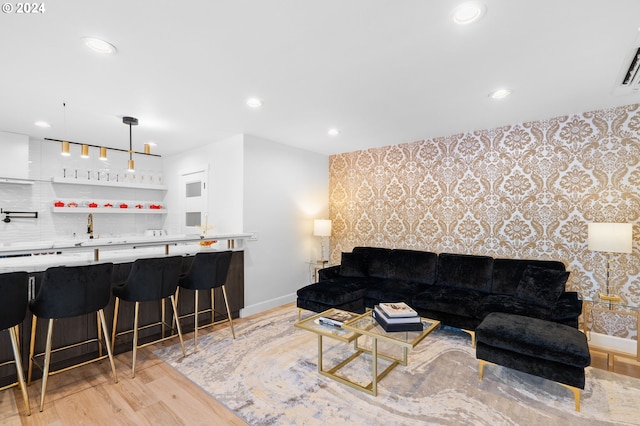 living room with light hardwood / wood-style flooring