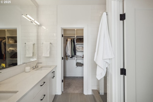 5674 NE 15th Ave, Portland, OR 97211 - full bathroom featuring a walk in closet and double vanity