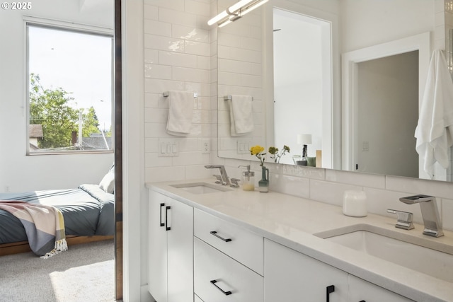 5674 NE 15th Ave, Portland, OR 97211 - ensuite bathroom with double vanity and decorative backsplash