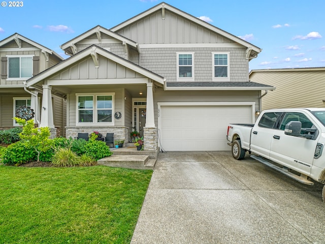 6212 N 87th Ave, Camas, WA 98607 - craftsman inspired home with board and batten siding, a garage, a front yard, concrete driveway, and stone siding