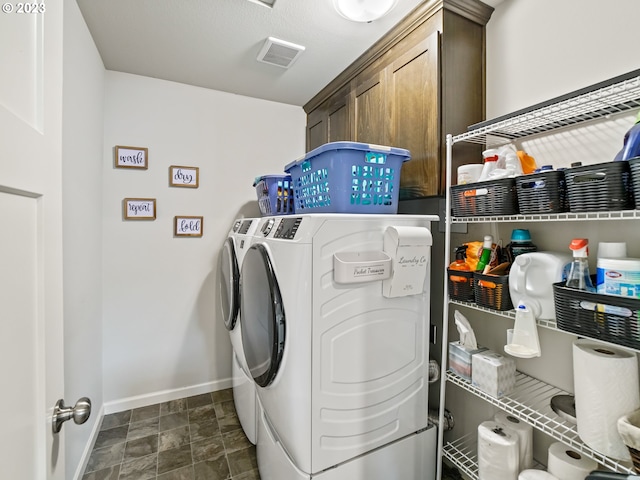 6212 N 87th Ave, Camas, WA 98607 - laundry area featuring separate washer and dryer, cabinet space, baseboards, and stone finish floors
