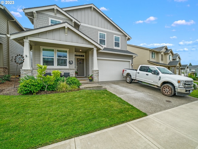6212 N 87th Ave, Camas, WA 98607 - craftsman-style house with board and batten siding, concrete driveway, a garage, a front yard, and stone siding