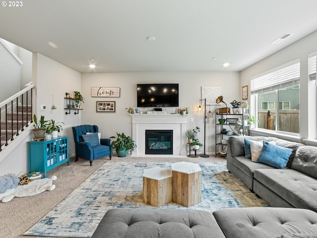 6212 N 87th Ave, Camas, WA 98607 - living area with stairs, carpet, a glass covered fireplace, and recessed lighting