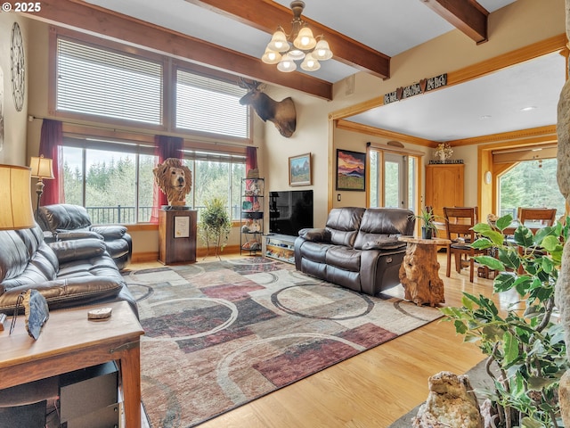 7145 SE Amity Dayton Hwy, Amity, OR 97101 - living area featuring wood finished floors, a chandelier, and beam ceiling