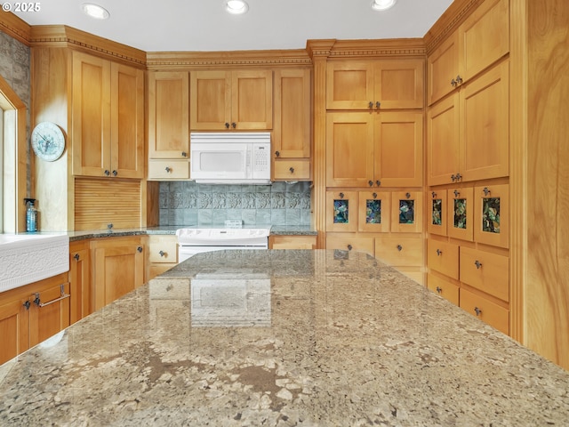 7145 SE Amity Dayton Hwy, Amity, OR 97101 - kitchen featuring white microwave, stove, light stone countertops, tasteful backsplash, and recessed lighting