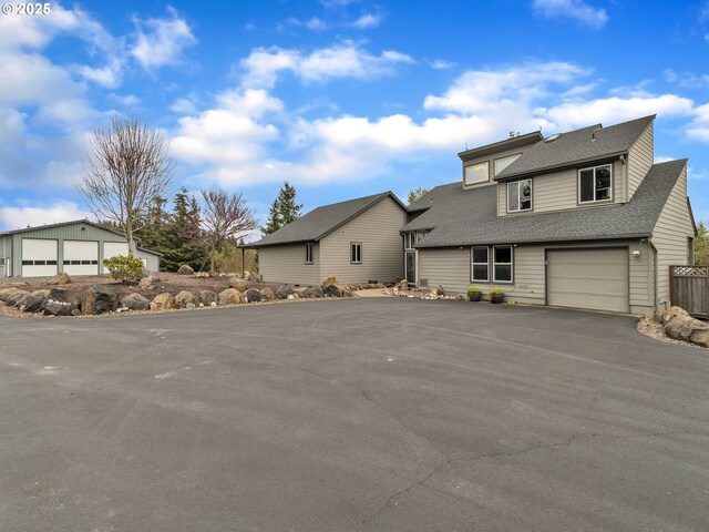 7145 SE Amity Dayton Hwy, Amity, OR 97101 - view of front of house with roof with shingles, asphalt driveway, and a garage
