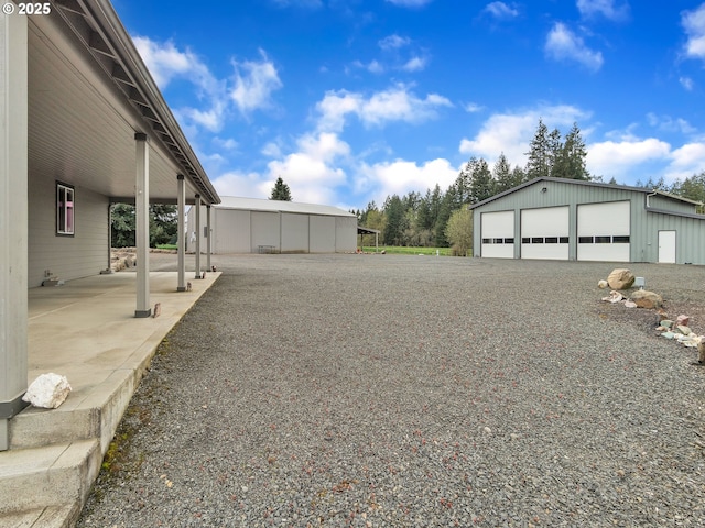 7145 SE Amity Dayton Hwy, Amity, OR 97101 - view of yard featuring a detached garage and an outbuilding