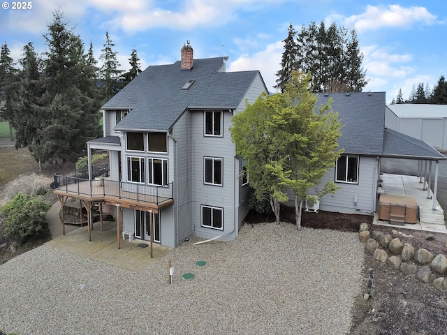 7145 SE Amity Dayton Hwy, Amity, OR 97101 - back of house with a patio, roof with shingles, a chimney, and a wooden deck