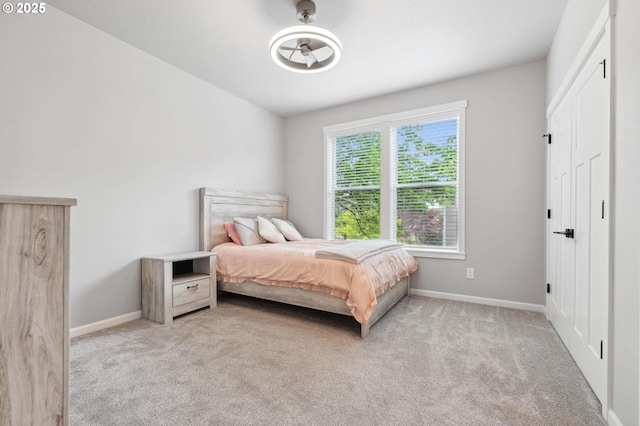 bedroom with baseboards and carpet flooring