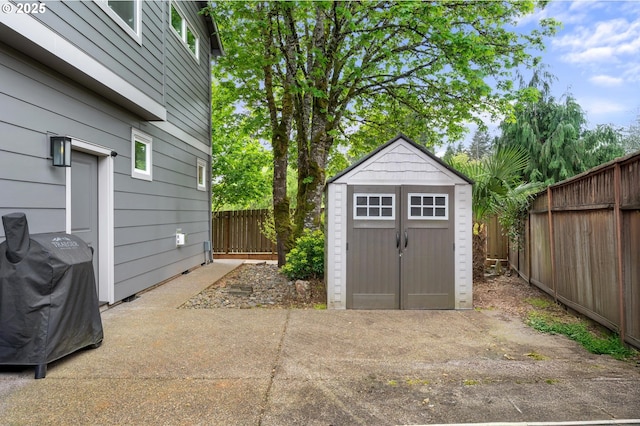 view of shed with a fenced backyard