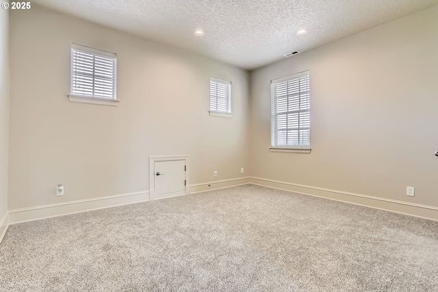 15610 SE Kingbird Dr, Happy Valley, OR 97015 - carpeted empty room with a textured ceiling, baseboards, and recessed lighting