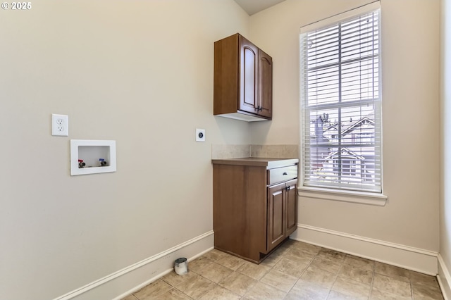 15610 SE Kingbird Dr, Happy Valley, OR 97015 - laundry area with baseboards, washer hookup, cabinet space, and plenty of natural light
