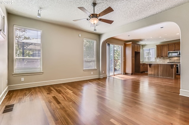 15610 SE Kingbird Dr, Happy Valley, OR 97015 - doorway with healthy amount of natural light, dark wood finished floors, and baseboards