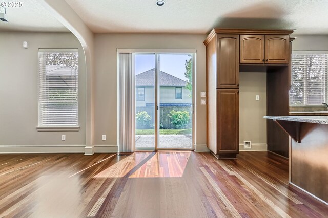 15610 SE Kingbird Dr, Happy Valley, OR 97015 - kitchen with stainless steel appliances, recessed lighting, a kitchen island, backsplash, and light wood-style floors