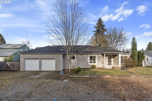 ranch-style home featuring a garage