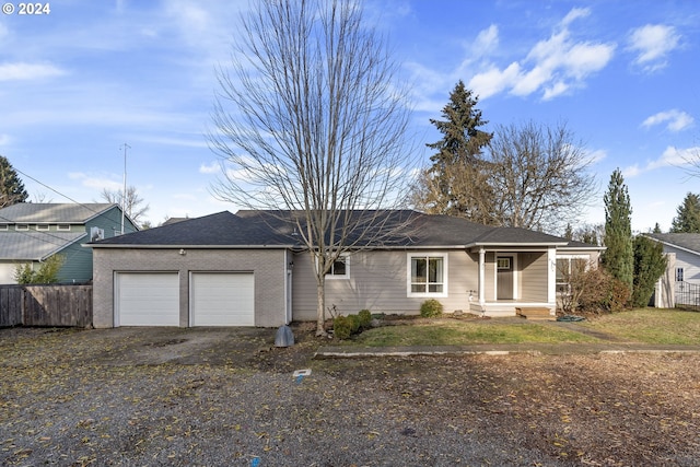 459 Churchdale Ave, Keizer, OR 97303 - ranch-style house featuring an attached garage, aphalt driveway, and fence
