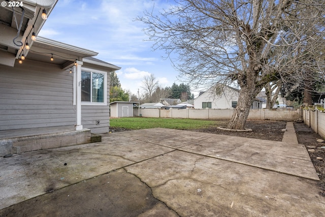 view of patio with a storage unit