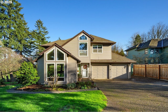 front facade with a garage and a front yard