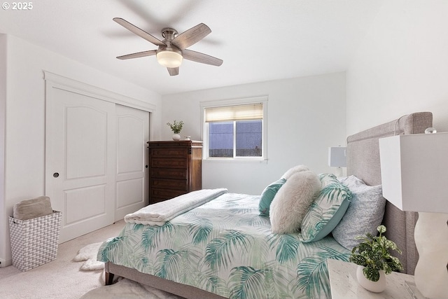 bedroom with carpet floors, a closet, and ceiling fan