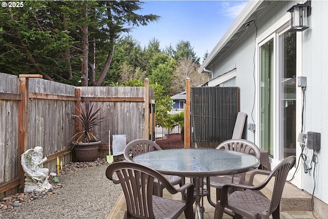 view of patio / terrace featuring outdoor dining space and fence