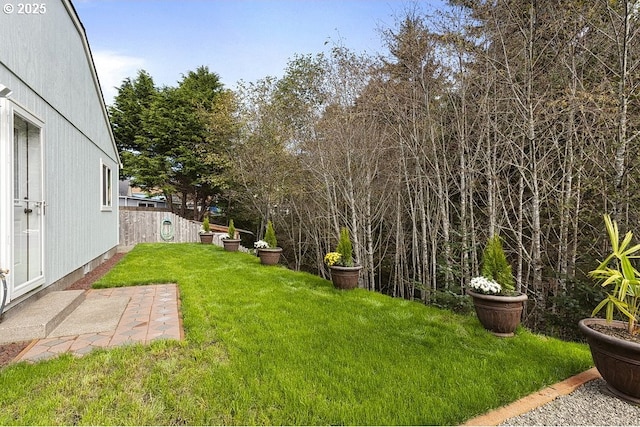 view of yard featuring a patio area and fence