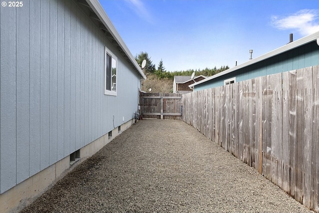 view of property exterior featuring crawl space and fence