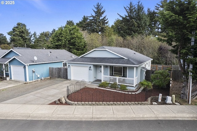 ranch-style house with a garage, a shingled roof, concrete driveway, covered porch, and fence