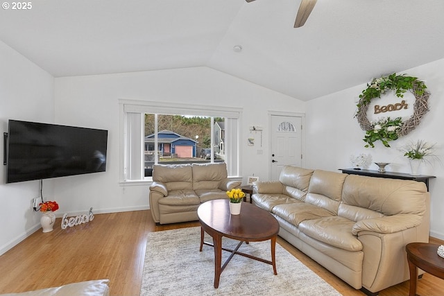 living room with vaulted ceiling, ceiling fan, wood finished floors, and baseboards