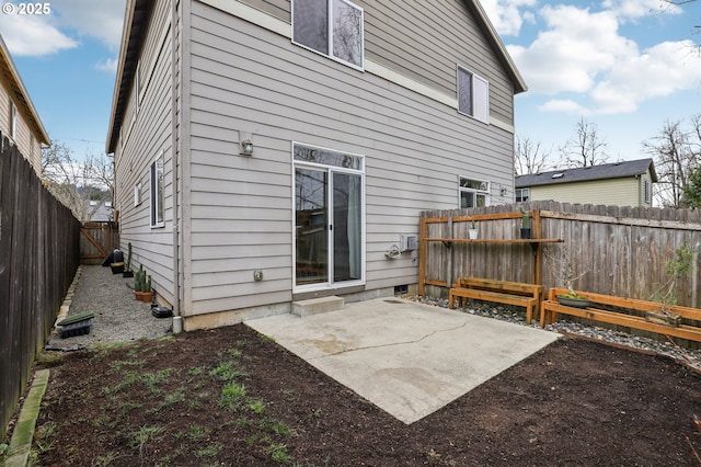 rear view of house featuring a patio area and a fenced backyard