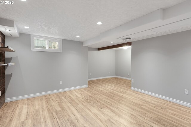 unfurnished living room featuring hardwood / wood-style flooring, built in shelves, and ceiling fan