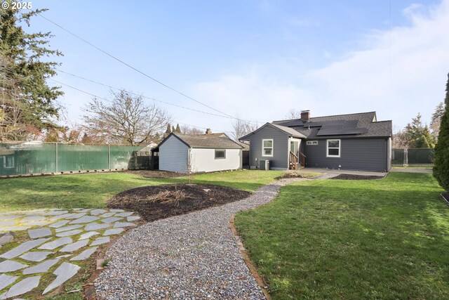 back of property with cooling unit and solar panels