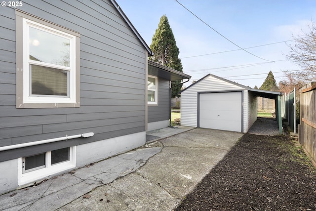 view of property exterior with an outbuilding, a garage, and a carport