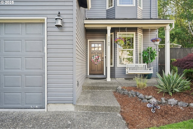 2149 SE Williams Dr, Gresham, OR 97080 - view of exterior entry with a garage and a porch