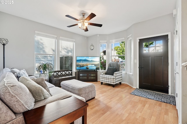 2149 SE Williams Dr, Gresham, OR 97080 - living room featuring light wood-style flooring, a ceiling fan, and baseboards