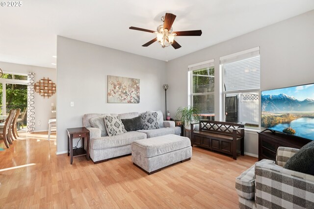 2149 SE Williams Dr, Gresham, OR 97080 - living room with ceiling fan, light wood-style floors, and baseboards
